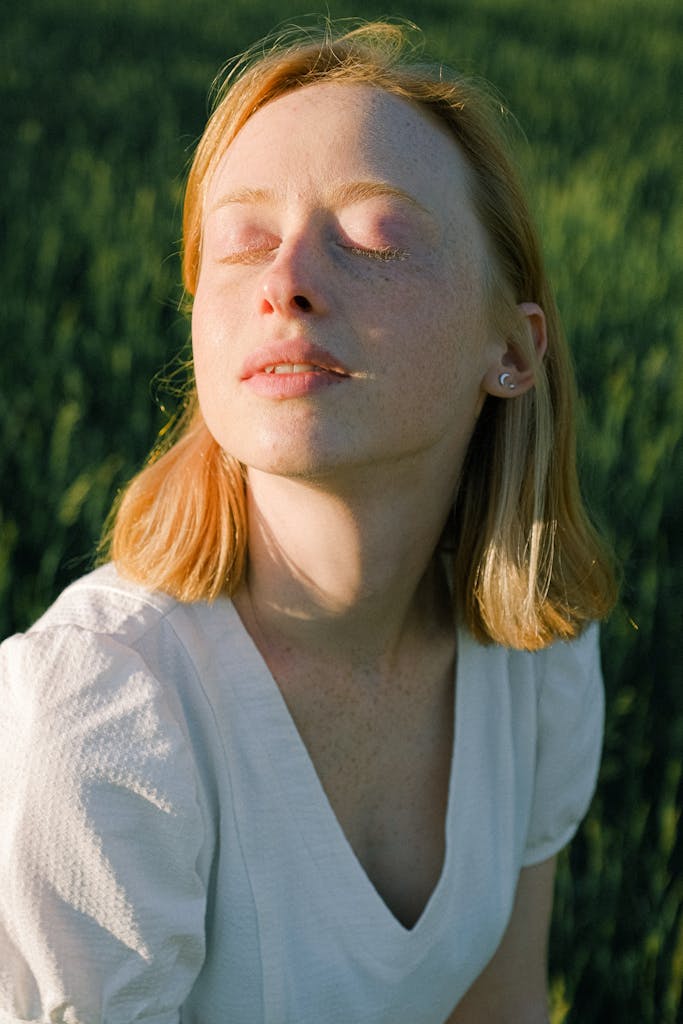 Woman enjoying a fresh breath of air, after airway dental improvements.